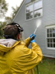 Pressure washing a house